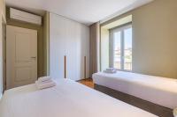 Postel nebo postele na pokoji v ubytování Liberdade Concept 3BDR Apartment by LovelyStay