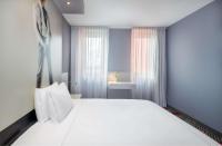 Ein Bett oder Betten in einem Zimmer der Unterkunft Park Plaza Berlin