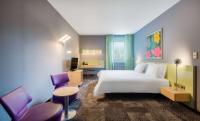 Ein Bett oder Betten in einem Zimmer der Unterkunft Park Plaza Berlin