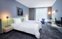 Ein Bett oder Betten in einem Zimmer der Unterkunft Park Plaza Berlin