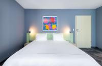Ein Bett oder Betten in einem Zimmer der Unterkunft Park Plaza Berlin