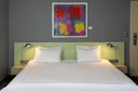 Ein Bett oder Betten in einem Zimmer der Unterkunft Park Plaza Berlin