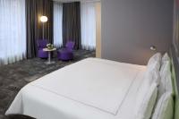 Ein Bett oder Betten in einem Zimmer der Unterkunft Park Plaza Berlin