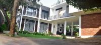 a large white building with a brick at Golden Ray villa in Anuradhapura