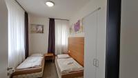 Postel nebo postele na pokoji v ubytování Apartments Gato Karlovy Vary Stara Role