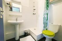 a white bathroom with a sink and a toilet at The Golfer&#39;s Nest #FP in Vaulnaveys-le-Haut
