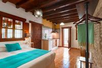 Posteľ alebo postele v izbe v ubytovaní SUITES CASA DE LAS COLUMNAS