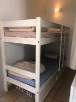 a bunk bed in a room with two bunk beds at Magnifique vue lac au Golf de Pont-Royal in Mallemort