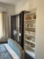 a bedroom with a bed and a book shelf at Spacieux T3 haussmannien in Toulon