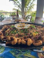 a tray of food on top of a table at Pousada Dona Tereza in Guapé