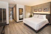 Ένα ή περισσότερα κρεβάτια σε δωμάτιο στο Hotel Quinta Norte Chipichape