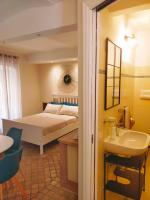 A bed or beds in a room at MancioBiba Home