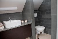 a bathroom with a sink and a toilet at B&amp;B - Ter Douve in Dranouter