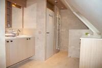 a bathroom with a sink and a staircase at B&amp;B - Ter Douve in Dranouter