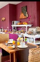 a kitchen with a table with food on it at Résidence Bellevue in Wimereux