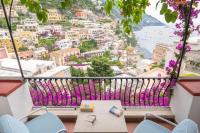 a balcony with a view of a city at Hotel Poseidon in Positano