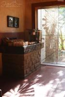 een keuken met een bakstenen aanrecht met potten en pannen bij Karoo Gariep Tented Camp in Hanover Road