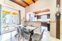 a kitchen and dining room with a table and chairs at Giourgas house in Chlomatianá