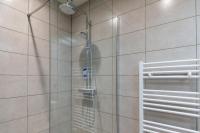a shower with a shower head in a bathroom at Standing Vieux port 110 m2, Marseille in Marseille