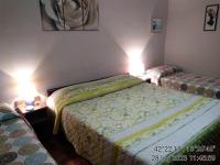 Posteľ alebo postele v izbe v ubytovaní Appartamenti Vista Gransasso