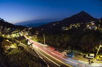 a night view of a highway with cars on it at Shabby Home 28 in Jiufen