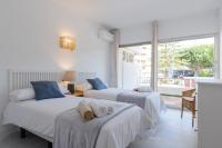 Postel nebo postele na pokoji v ubytování Jardines del Mar Apartments