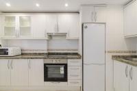 Kuchyň nebo kuchyňský kout v ubytování Jardines del Mar Apartments