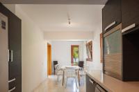 a kitchen and dining room with a table and chairs at Angels Villa in Kambánion