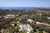 an aerial view of a house and the ocean at Angels Villa in Kambánion
