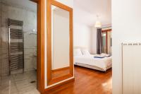 a mirror in a room with a bed and a bedroom at Angels Villa in Kambánion