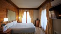 Posteľ alebo postele v izbe v ubytovaní Hotel Grèvol Spa