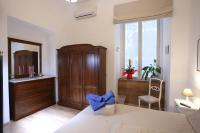 A bed or beds in a room at Napoli Pietrasanta LT