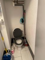 a small bathroom with a toilet in a stall at Superbe appartement 6 personnes avec piscine secteur Richelieu, à 400m de la plage et à 650m du centre port in Cap d&#39;Agde