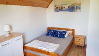 Posteľ alebo postele v izbe v ubytovaní Domki letniskowe,apartamenty Wczasowa 8a