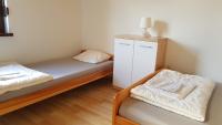 Posteľ alebo postele v izbe v ubytovaní Domki letniskowe,apartamenty Wczasowa 8a