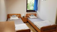 Posteľ alebo postele v izbe v ubytovaní Domki letniskowe,apartamenty Wczasowa 8a