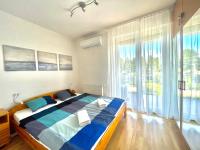Posteľ alebo postele v izbe v ubytovaní Balaton BeachSide Apartman Siófok N2