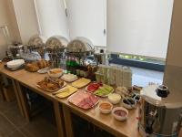 a table with many different types of food on it at Prime Hotel in Gyumri