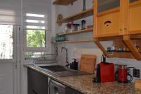 A kitchen or kitchenette at happy2 Dafni Family home near Athens, airport, ports