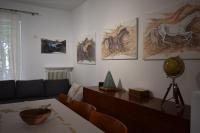 A seating area at happy2 Dafni Family home near Athens, airport, ports