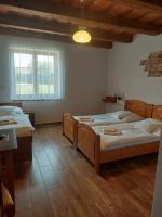 Postel nebo postele na pokoji v ubytování Hotel Tři Věžičky