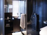 a bathroom with a sink and a glass shower at Hotel Relax I in Taipei