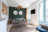 Televízia a/alebo spoločenská miestnosť v ubytovaní T2 - Rue de la République - Cosy