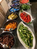 a table topped with bowls of different types of vegetables at Lupo Libero Hotel Spa in Antalya