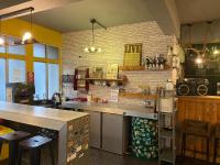 a kitchen with a counter and a counter top at Hive Bed and Backpacker蜂巢膠囊旅店 in Hualien City
