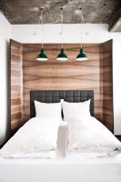 A bed or beds in a room at Hotel Daniel Vienna - Smart Lifestyle Near City Centre