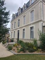 a large house with a garden in front of it at LES 5 ESCALES in Parthenay