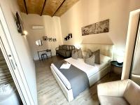 A bed or beds in a room at San Pietro Rooms 84
