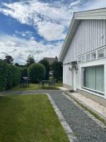 a house with a picnic table next to a building at Studiolägenhet i Höga Kusten in Ullanger