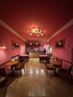a restaurant with tables and chairs in a room at Hotel De La Villa in Rubielos de Mora